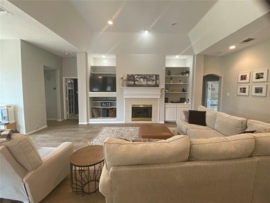 This single-story home, situated in a cul-de-sac, features three on The Golf Club at Fossil Creek in Texas - for sale on GolfHomes.com, golf home, golf lot