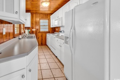 Adorable beach cottage situated just one short block (450 feet) on Beachwood Golf Club in South Carolina - for sale on GolfHomes.com, golf home, golf lot