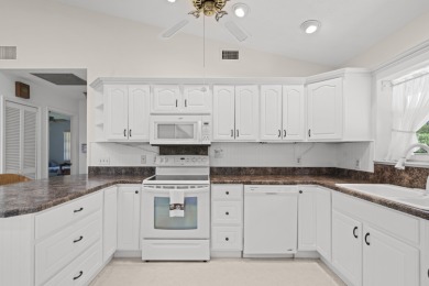 Charming CBS home in Country Club Cove, a quiet community of on Miles Grant Country Club in Florida - for sale on GolfHomes.com, golf home, golf lot