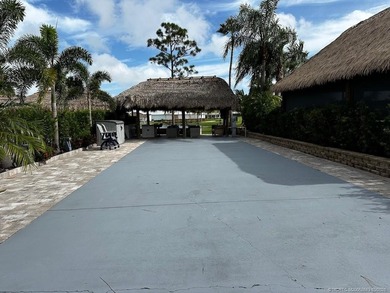 Prime Lakefront Lot with Golf Course Views - Fully Furnished! on Motorcoach Resort Golf Course in Florida - for sale on GolfHomes.com, golf home, golf lot