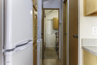 Welcome to your own private retreat in this stunning 1 bedroom on Palm Creek Golf and RV Resort in Arizona - for sale on GolfHomes.com, golf home, golf lot