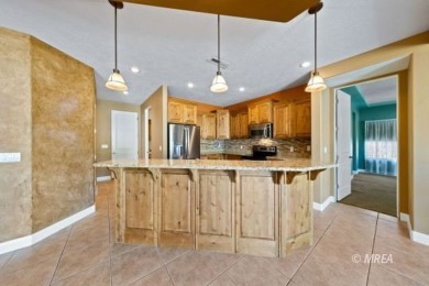 This beautifully designed home sits on a desirable corner lot on The Oasis Golf Club in Nevada - for sale on GolfHomes.com, golf home, golf lot