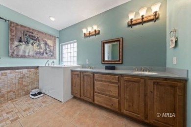 This beautifully designed home sits on a desirable corner lot on The Oasis Golf Club in Nevada - for sale on GolfHomes.com, golf home, golf lot
