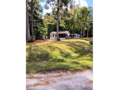 Experience lake life with water views of Lake Royale! Large on River Golf and Country Club at Lake Royale in North Carolina - for sale on GolfHomes.com, golf home, golf lot