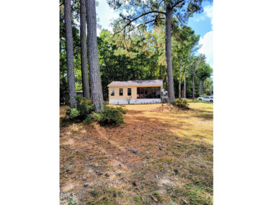Experience lake life with water views of Lake Royale! Large on River Golf and Country Club at Lake Royale in North Carolina - for sale on GolfHomes.com, golf home, golf lot