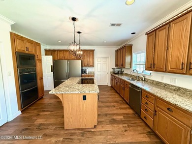 Perfectly positioned on a double lot along the Pine Golf on Diamondhead Country Club in Mississippi - for sale on GolfHomes.com, golf home, golf lot