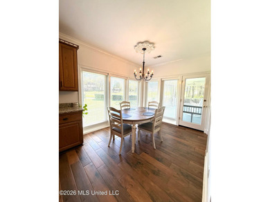 Perfectly positioned on a double lot along the Pine Golf on Diamondhead Country Club in Mississippi - for sale on GolfHomes.com, golf home, golf lot