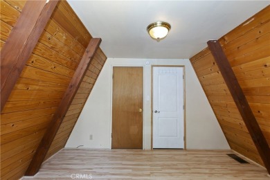 Nestled in the charming Moonridge community of Big Bear, this on Big Bear Mountain Ski and Golf Resort in California - for sale on GolfHomes.com, golf home, golf lot