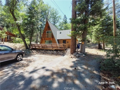 Nestled in the charming Moonridge community of Big Bear, this on Big Bear Mountain Ski and Golf Resort in California - for sale on GolfHomes.com, golf home, golf lot