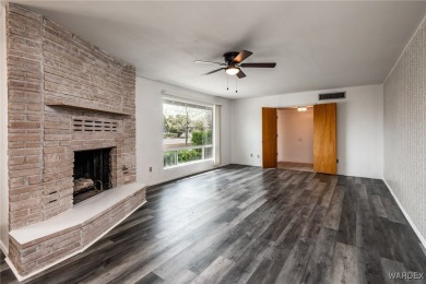 Welcome to this beautifully updated 4-bedroom, 2.5-bathroom home on Cerbat Cliffs Golf Course in Arizona - for sale on GolfHomes.com, golf home, golf lot