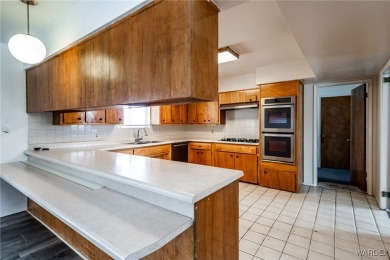 Welcome to this beautifully updated 4-bedroom, 2.5-bathroom home on Cerbat Cliffs Golf Course in Arizona - for sale on GolfHomes.com, golf home, golf lot