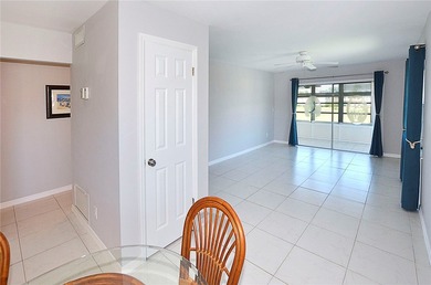 Remodeled end unit w/ serene golf/lake views, tons of natural on The American Golf Club in Florida - for sale on GolfHomes.com, golf home, golf lot