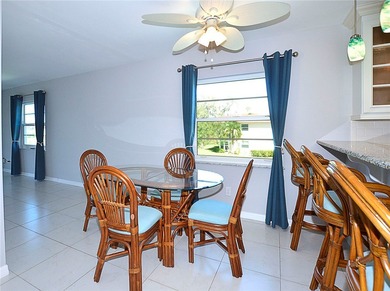 Remodeled end unit w/ serene golf/lake views, tons of natural on The American Golf Club in Florida - for sale on GolfHomes.com, golf home, golf lot