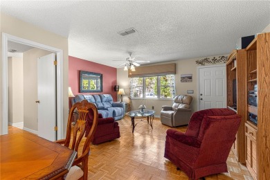 PRICE IMPROVEMENT ON THIS UNIQUE MAPLE MODEL, being offered as on The Links of Spruce Creek in Florida - for sale on GolfHomes.com, golf home, golf lot