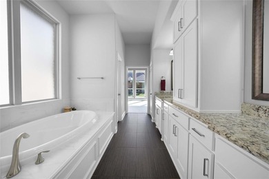 Welcome to resort-style living in The Tribute, a premier on The Tribute At the Colony in Texas - for sale on GolfHomes.com, golf home, golf lot