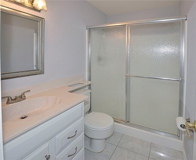 Remodeled end unit w/ serene golf/lake views, tons of natural on The American Golf Club in Florida - for sale on GolfHomes.com, golf home, golf lot