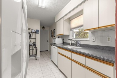 PRICE IMPROVEMENT ON THIS UNIQUE MAPLE MODEL, being offered as on The Links of Spruce Creek in Florida - for sale on GolfHomes.com, golf home, golf lot