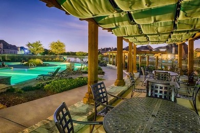 Welcome to resort-style living in The Tribute, a premier on The Tribute At the Colony in Texas - for sale on GolfHomes.com, golf home, golf lot