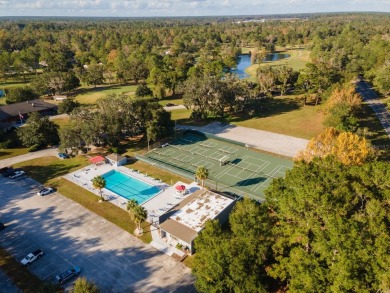 Welcome to the only two-story home in the gated Creekside Villas on Turkey Creek Golf and Country Club in Florida - for sale on GolfHomes.com, golf home, golf lot