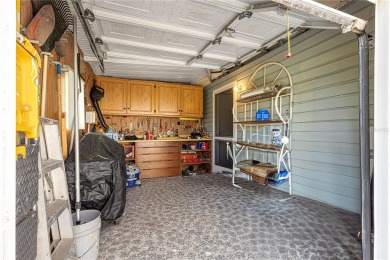 PRICE IMPROVEMENT ON THIS UNIQUE MAPLE MODEL, being offered as on The Links of Spruce Creek in Florida - for sale on GolfHomes.com, golf home, golf lot
