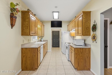 This charming three-bedroom, two-bath condo is tucked away in on Rock Springs Golf Course in Tennessee - for sale on GolfHomes.com, golf home, golf lot