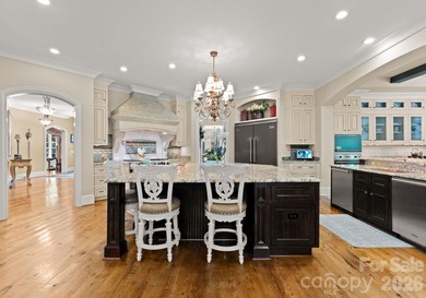 This custom estate embodies luxury, privacy, and timeless on The Palisades Country Club in North Carolina - for sale on GolfHomes.com, golf home, golf lot