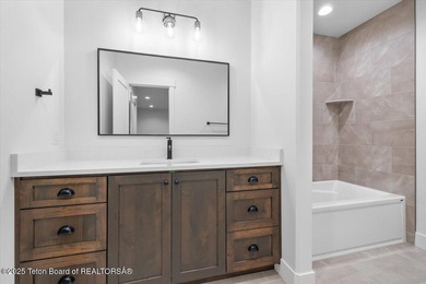 Discover elevated mountain living in this brand-new custom home on Teton Reserve in Idaho - for sale on GolfHomes.com, golf home, golf lot