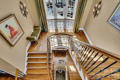 This custom estate embodies luxury, privacy, and timeless on The Palisades Country Club in North Carolina - for sale on GolfHomes.com, golf home, golf lot