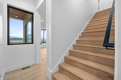 Discover elevated mountain living in this brand-new custom home on Teton Reserve in Idaho - for sale on GolfHomes.com, golf home, golf lot