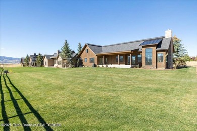 Discover elevated mountain living in this brand-new custom home on Teton Reserve in Idaho - for sale on GolfHomes.com, golf home, golf lot