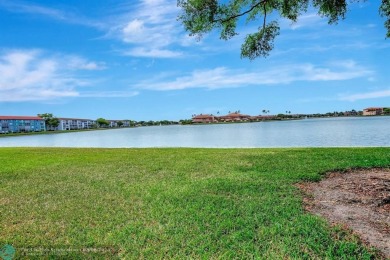 Enjoy the spectacular LAKE view from this beautiful and LARGE on Flamingo Lakes Country Club in Florida - for sale on GolfHomes.com, golf home, golf lot