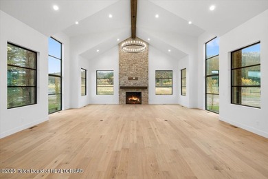 Discover elevated mountain living in this brand-new custom home on Teton Reserve in Idaho - for sale on GolfHomes.com, golf home, golf lot