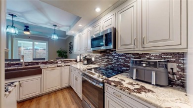 This beautifully upgraded townhome is tucked away in a desirable on Belleview Biltmore Golf Club in Florida - for sale on GolfHomes.com, golf home, golf lot
