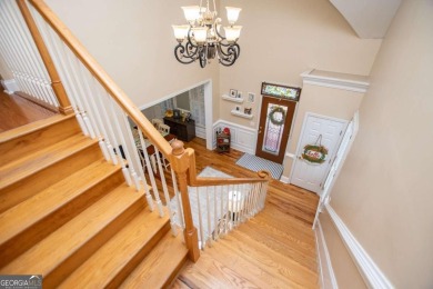 Welcome to this amazing home filled with southern charm nestled on Mirror Lake Golf Club in Georgia - for sale on GolfHomes.com, golf home, golf lot