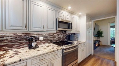 This beautifully upgraded townhome is tucked away in a desirable on Belleview Biltmore Golf Club in Florida - for sale on GolfHomes.com, golf home, golf lot