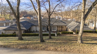 Waterfront luxury on Ridge Road in the gated community of The on The Coves Golf Course in Oklahoma - for sale on GolfHomes.com, golf home, golf lot