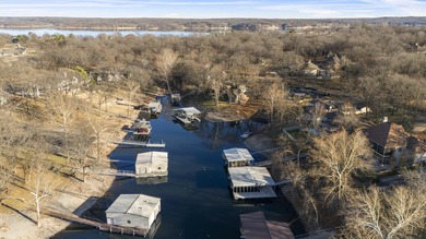 Waterfront luxury on Ridge Road in the gated community of The on The Coves Golf Course in Oklahoma - for sale on GolfHomes.com, golf home, golf lot