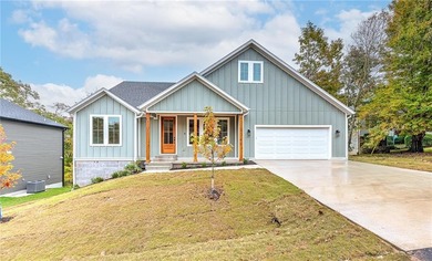 Discover elevated living in this meticulously maintained on Bella Vista - Metfield Golf Complex and Country Club in Arkansas - for sale on GolfHomes.com, golf home, golf lot