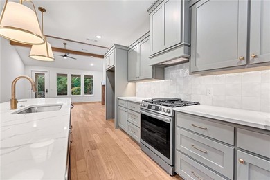 Discover elevated living in this meticulously maintained on Bella Vista - Metfield Golf Complex and Country Club in Arkansas - for sale on GolfHomes.com, golf home, golf lot