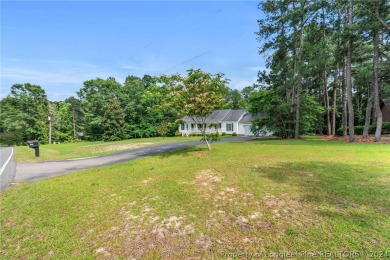 MOVE IN READY HOME WITH A VIEW OF THE DRIVING RANGE , 10TH HOLE on Quail Ridge Golf Course in North Carolina - for sale on GolfHomes.com, golf home, golf lot