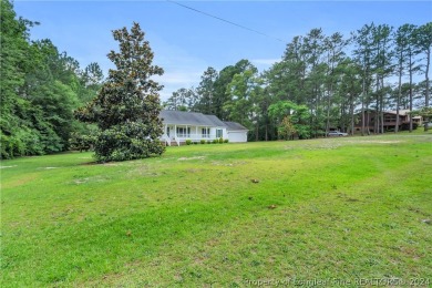 MOVE IN READY HOME WITH A VIEW OF THE DRIVING RANGE , 10TH HOLE on Quail Ridge Golf Course in North Carolina - for sale on GolfHomes.com, golf home, golf lot