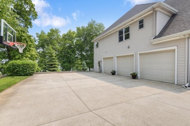 Comfortable and welcoming with 260 feet of water frontage, and on Island Hills Golf Club in Michigan - for sale on GolfHomes.com, golf home, golf lot