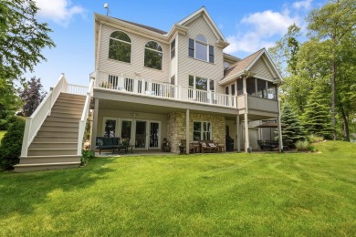 Comfortable and welcoming with 260 feet of water frontage, and on Island Hills Golf Club in Michigan - for sale on GolfHomes.com, golf home, golf lot