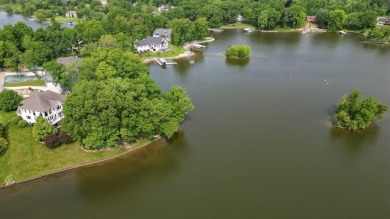 Comfortable and welcoming with 260 feet of water frontage, and on Island Hills Golf Club in Michigan - for sale on GolfHomes.com, golf home, golf lot