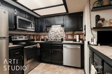 Discover this highly desirable lower-level unit in the Rock on The Oasis Golf Club in Nevada - for sale on GolfHomes.com, golf home, golf lot