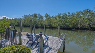 Coastal elegance meets island living in Bay Isles Bayou on on Longboat Key Golf Club Resort in Florida - for sale on GolfHomes.com, golf home, golf lot