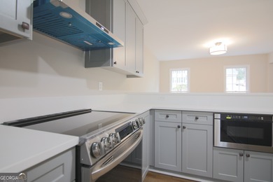 Renovations are complete! This huge home comes complete with a on Brookstone Golf and Country Club in Georgia - for sale on GolfHomes.com, golf home, golf lot