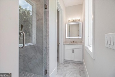 Set on a private 2.3-acre creek-lined homesite in the on Echelon Golf Club in Georgia - for sale on GolfHomes.com, golf home, golf lot