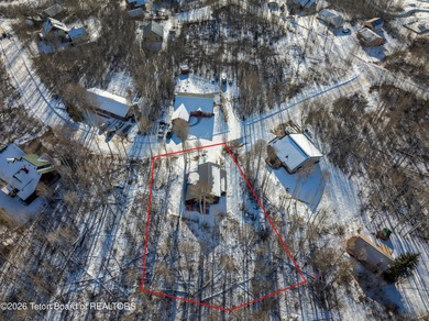 Tucked among the aspen and pines in Star Valley Ranch, this on Star Valley RV Golf Course in Wyoming - for sale on GolfHomes.com, golf home, golf lot