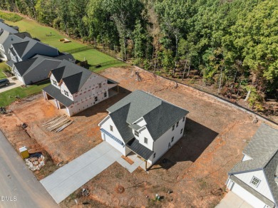 Welcome home to this spacious 4-bedroom, 2.5-bath residence on Olde Liberty Golf and Country Club in North Carolina - for sale on GolfHomes.com, golf home, golf lot